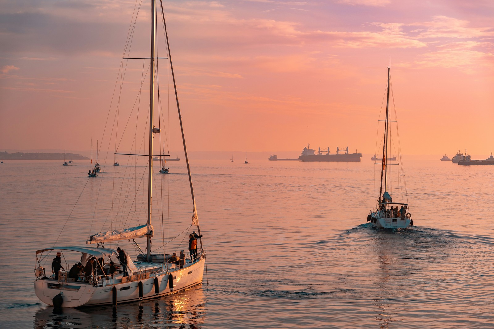 Sailing through a pink-hued sunset off the coast of Greece.