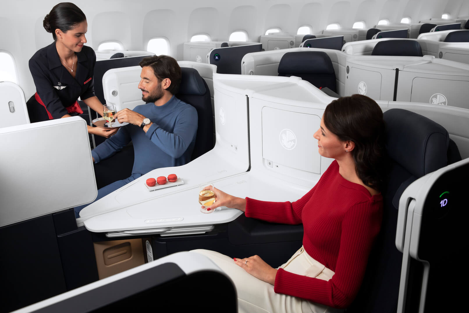 Lower the center walls to connect with other passengers or enjoy the flight together in Air France's new business class cabin. Photo by Air France.