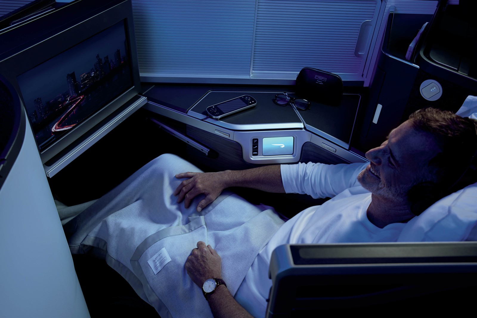 Business Class seat and in-flight entertainment in the British Airways Club Suite. Photo by British Airways.