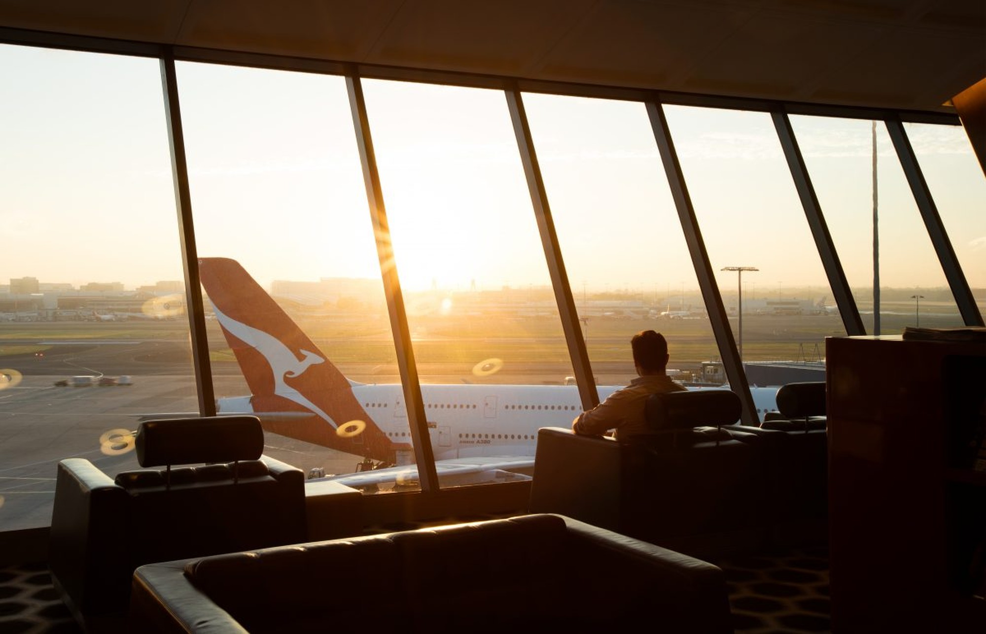 Qantas First Lounge at Sydney Airport with stunning sunrise views. Photo by Qantas.