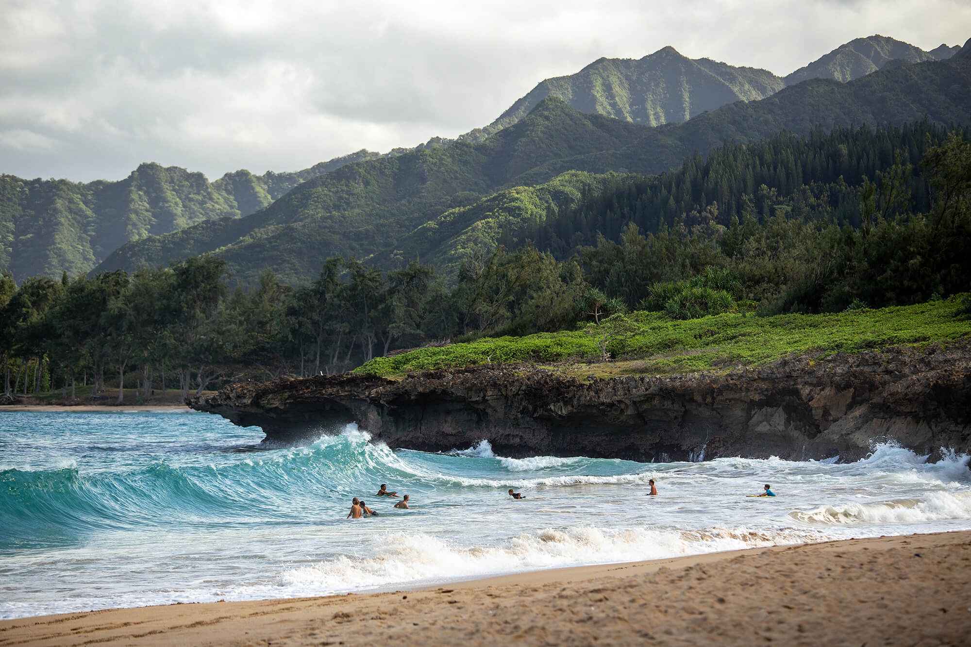 Road tripping around Oahu, exploring its northern beaches to catch some sun and watch local surfers riding the waves. Photo by Luke McKeown