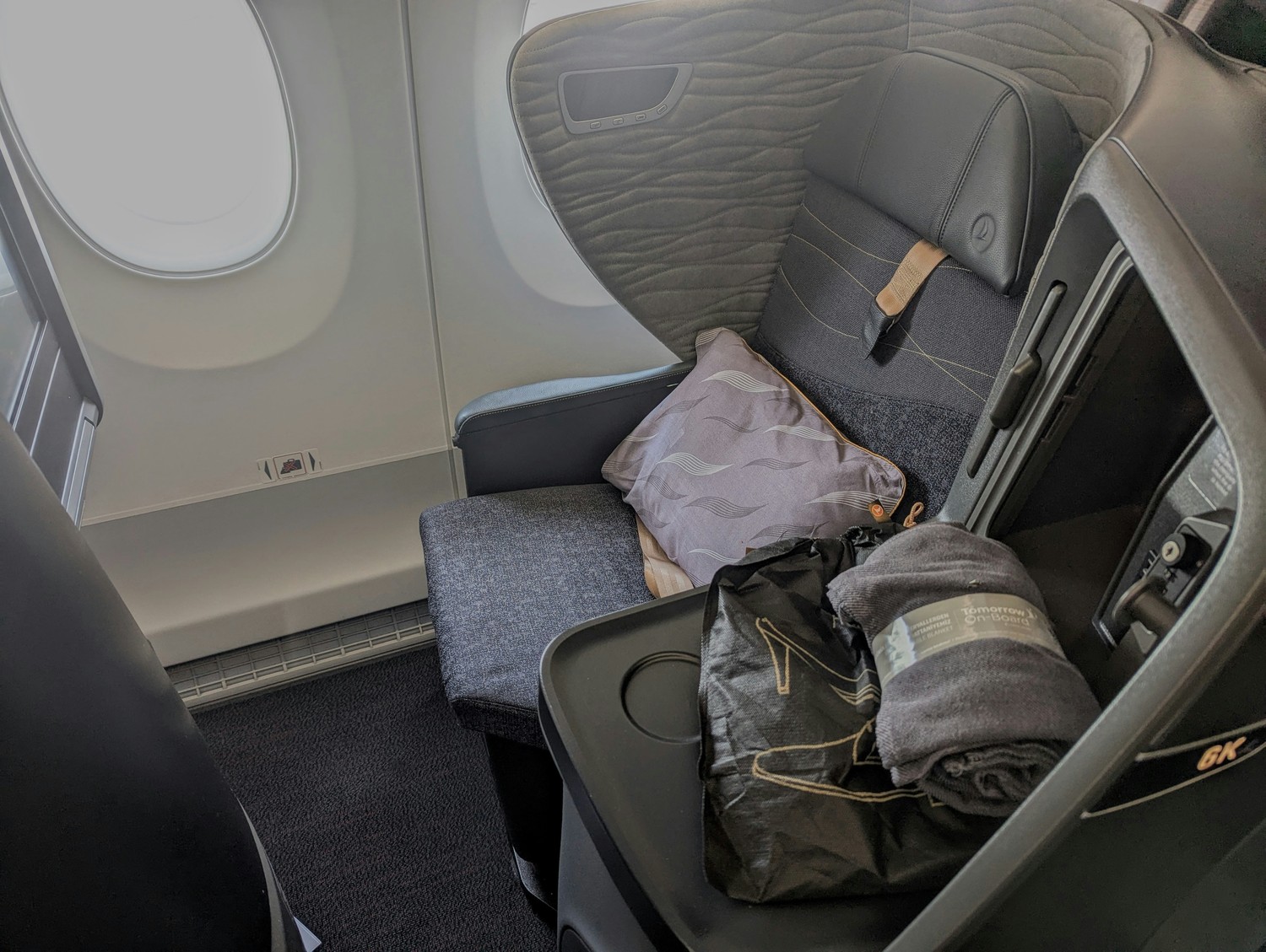 Window seat in Turkish Airlines Business Class featuring a private shell and side console. Photo by Frugal Flyer.