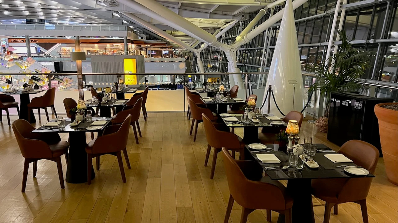 Concorde Room terrace dining tables overlooking Terminal 5 next to genuine Concorde nose cone