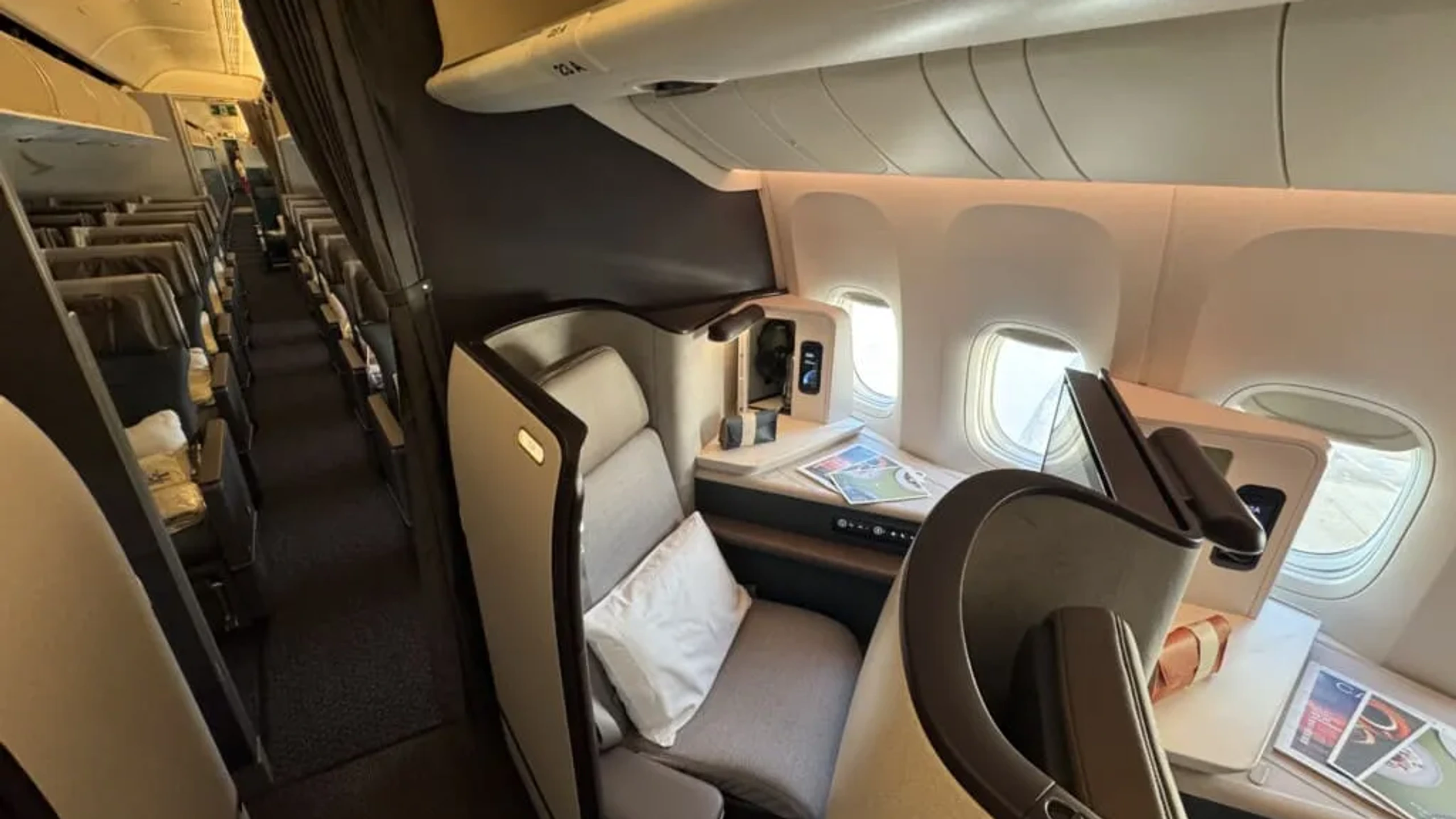 Cathay Pacific Aria Suite reverse herringbone with sliding privacy door