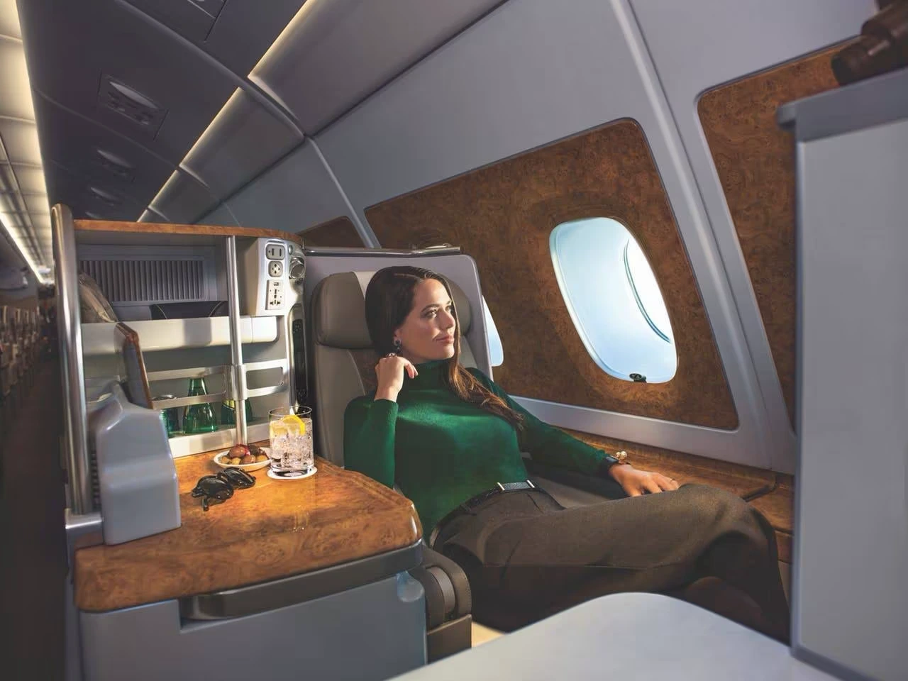 Emirates premium cabin suite — consolidator pricing makes aspirational travel accessible. Photo by Emirates.