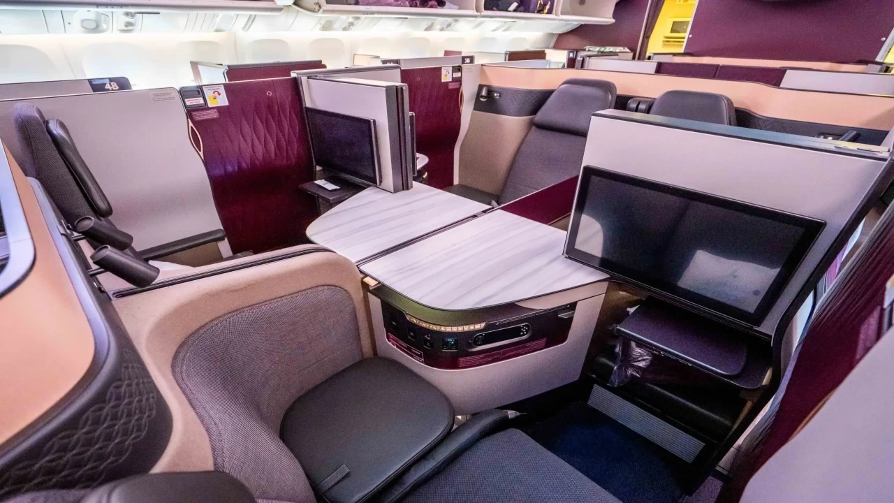 Photo by Qatar Airways. The QSuite's sliding doors turn a business class seat into a genuine private room at 40,000 feet